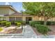 Charming single-story home featuring a well-maintained front yard with mature trees and lush landscaping at 3062 El Camino Ave, Las Vegas, NV 89102