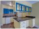 Bright kitchen equipped with essential appliances, cabinetry, and a functional island for meal preparation and serving at 3062 El Camino Ave, Las Vegas, NV 89102