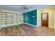 Spacious living room with wood flooring and built in shelving offers ample storage and comfort at 3062 El Camino Ave, Las Vegas, NV 89102