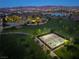 Aerial view of community park, tennis courts, and green spaces providing a scenic environment for residents at 361 Andy Wheeler Dr, Henderson, NV 89011