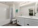Bathroom featuring white cabinets, a toilet, a bath tub with shower and modern finishes at 361 Andy Wheeler Dr, Henderson, NV 89011
