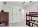 Bedroom featuring a bunk bed, a ceiling fan, and a closet with sliding doors at 361 Andy Wheeler Dr, Henderson, NV 89011