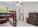 Bedroom with a bunk bed, dresser, and two windows that provide ample natural light at 361 Andy Wheeler Dr, Henderson, NV 89011