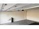 An empty garage featuring a mechanical door, and gray concrete floor at 361 Andy Wheeler Dr, Henderson, NV 89011