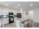 Bright kitchen with white cabinetry, stainless steel appliances, and a spacious center island at 361 Andy Wheeler Dr, Henderson, NV 89011