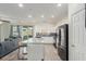 Modern kitchen features stainless steel appliances, granite countertops, and an island at 361 Andy Wheeler Dr, Henderson, NV 89011