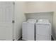 Neat laundry room with side-by-side washer and dryer at 361 Andy Wheeler Dr, Henderson, NV 89011