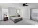 Spacious main bedroom with neutral decor, ceiling fan, and multiple windows at 361 Andy Wheeler Dr, Henderson, NV 89011