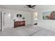 Comfortable main bedroom with a ceiling fan and a view of the ensuite bathroom at 361 Andy Wheeler Dr, Henderson, NV 89011