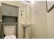 Cozy half-bathroom with pedestal sink and neutral color scheme at 361 Andy Wheeler Dr, Henderson, NV 89011