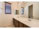 Bright bathroom with double sinks and vanity, offering natural light and a clean design at 3910 Internet Ave, North Las Vegas, NV 89031