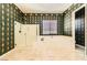 Bathroom featuring a soaking tub, frameless shower, and window at 3910 Internet Ave, North Las Vegas, NV 89031