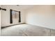 Spacious bedroom featuring neutral carpet and a window, creating a calming and inviting atmosphere at 3910 Internet Ave, North Las Vegas, NV 89031