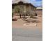 Exterior view showing stone accents, desert landscaping and drainage ditch at 3910 Internet Ave, North Las Vegas, NV 89031