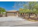 Beautiful single-story home with stone detailing, a spacious driveway, and an attached two-car garage at 3910 Internet Ave, North Las Vegas, NV 89031