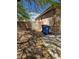 Side yard featuring rock landscaping, privacy wall, and gate access to the house at 3910 Internet Ave, North Las Vegas, NV 89031