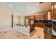Well-appointed kitchen with a center island, stainless steel appliances, and rich wood cabinetry at 3910 Internet Ave, North Las Vegas, NV 89031