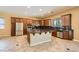Modern kitchen with stainless steel appliances, granite countertops, and a large center island at 3910 Internet Ave, North Las Vegas, NV 89031
