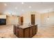 Open-concept kitchen featuring an island with granite countertop and modern appliances at 3910 Internet Ave, North Las Vegas, NV 89031