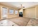 Open living room with a modern fireplace, neutral walls, and tile flooring with carpet inlay at 3910 Internet Ave, North Las Vegas, NV 89031