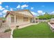 Expansive backyard with well-manicured lawn and patio under a pergola at 417 Carlton Kay Pl, Las Vegas, NV 89144