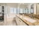 Bathroom featuring double sinks, shower, and bright natural light at 417 Carlton Kay Pl, Las Vegas, NV 89144