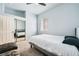 This bedroom features neutral colors, a bed, and mirrored closet at 417 Carlton Kay Pl, Las Vegas, NV 89144