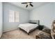 Cozy bedroom featuring a comfortable bed, window, and carpeted floors at 417 Carlton Kay Pl, Las Vegas, NV 89144