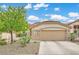 Charming single-story home with desert landscaping and a two-car garage, creating curb appeal at 417 Carlton Kay Pl, Las Vegas, NV 89144