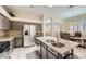 Stylish kitchen featuring stainless steel appliances, granite countertops, and a functional center island at 417 Carlton Kay Pl, Las Vegas, NV 89144