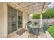 Covered patio with outdoor dining set and grill, perfect for entertaining at 417 Carlton Kay Pl, Las Vegas, NV 89144