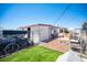 Enclosed backyard with a small grass area and outdoor storage at 4412 Baxter Pl, Las Vegas, NV 89107