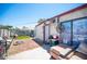 Practical backyard area with seating and additional storage. Includes a small dog house at 4412 Baxter Pl, Las Vegas, NV 89107