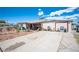 Single-story home with spacious driveway and low-maintenance desert landscaping at 4412 Baxter Pl, Las Vegas, NV 89107