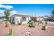 Inviting single-story home featuring drought-tolerant landscaping and a minimalist aesthetic at 4412 Baxter Pl, Las Vegas, NV 89107