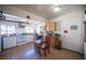 Sunny kitchen features white cabinets, tile floors, and a cozy dining area at 4412 Baxter Pl, Las Vegas, NV 89107