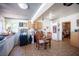 Spacious kitchen with white cabinets, tile floors, and a dining table for meals at 4412 Baxter Pl, Las Vegas, NV 89107