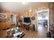 Open living room with tile floors and an open doorway leading to the kitchen at 4412 Baxter Pl, Las Vegas, NV 89107