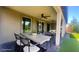 Covered back patio with dining and living space, perfect for entertaining at 4844 E Cactus Canyon Dr, Pahrump, NV 89061