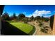 Backyard putting green and desert landscaping with a great view at 4844 E Cactus Canyon Dr, Pahrump, NV 89061