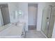 Bright bathroom with double vanity, large mirrors, and a glass-enclosed shower at 4844 E Cactus Canyon Dr, Pahrump, NV 89061