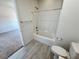 Neutral full bathroom with tub, shower, and wood look flooring at 4844 E Cactus Canyon Dr, Pahrump, NV 89061