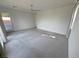 Neutral bedroom with ceiling fan, carpeted floors and access to outdoor patio at 4844 E Cactus Canyon Dr, Pahrump, NV 89061