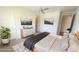 Modern bedroom featuring neutral decor, a stylish dresser, and black and white landscape art above the bed at 4844 E Cactus Canyon Dr, Pahrump, NV 89061