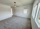 Carpeted bedroom with ceiling fan and natural lighting at 4844 E Cactus Canyon Dr, Pahrump, NV 89061