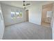 Bright bedroom with carpet, three windows, and ensuite bathroom at 4844 E Cactus Canyon Dr, Pahrump, NV 89061