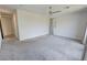 Neutral bedroom with carpet, ceiling fan, and access to other parts of the home at 4844 E Cactus Canyon Dr, Pahrump, NV 89061