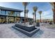 Community center featuring a modern design, outdoor seating, and a beautiful water feature at 4844 E Cactus Canyon Dr, Pahrump, NV 89061