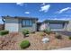 Charming single-story home featuring desert landscaping and a two-car garage, set against a bright blue sky at 4844 E Cactus Canyon Dr, Pahrump, NV 89061