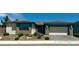 Inviting single-story home boasting desert-style landscaping and a convenient two-car garage, perfect for modern living at 4844 E Cactus Canyon Dr, Pahrump, NV 89061